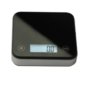 The AWS Cube 1-KG Scale has a black and white display that shows weight and temperature in grams and Celsius. It's compact, easy to use, and designed for kitchen use with a sleek modern design.