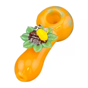 Smoking pipe with yellow smiley face design.