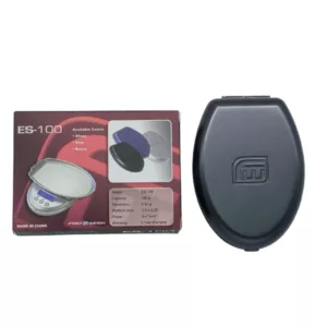 The ES-100 by AWS is a small, portable device with a black plastic case and clear plastic cover. It features a rectangular shape with rounded edges, a small hole for inserting the battery, and a small button on the top for turning the device on and off. The back of the case has a small hole for attaching the device to a belt or other object. It can be used to measure weight, body fat percentage, and other body measurements.