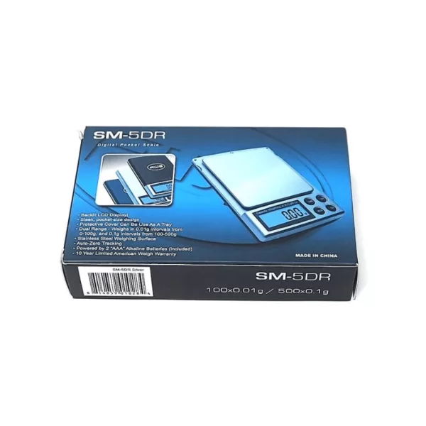 Small electronic scale with blue and white box for holding small items. Digital display shows weight in grams and kilograms. High quality and designed for precision.