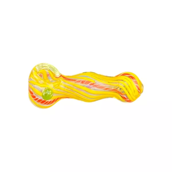 A yellow and red striped glass pipe with a green leaf on the end, sitting on a white background.
