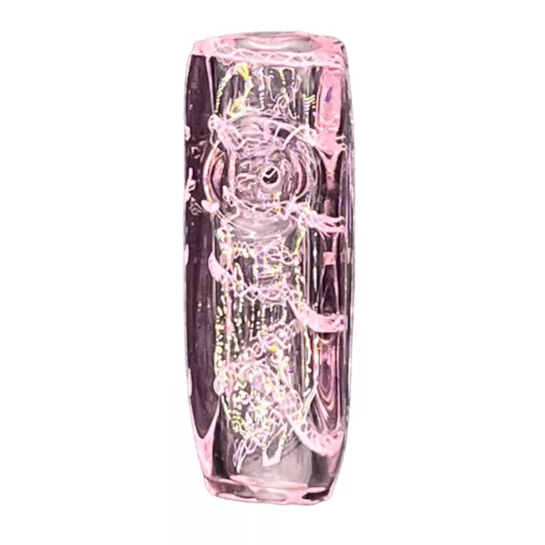 A clear glass vase with a pink flower in it, rectangular shape with white base, pink flower with 4 petals and yellow center, no leaves or stems.