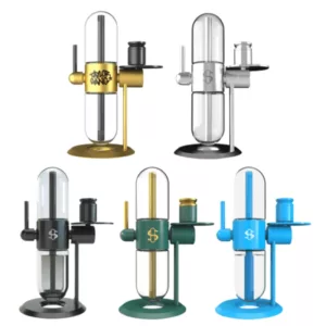 The Collab Gravity Hookah features a glass beaker with a metal stand and handle, a transparent blue, green, and yellow color scheme, and a circular base with four legs. The handle has a small knob on top.