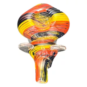 colorful glass sculpture of an animal, possibly a giraffe, with bright orange, yellow, and black colors. It has a symmetrical design and an overall effect of movement and energy.