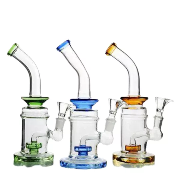Three glass water pipes in different colors, arranged in a row. The transparent one has a shower perc and is bent at the top. The background is white.