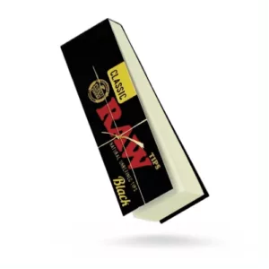 Black notebook with yellow Ramadan cover in Arabic. Gold border and ribbon. Empty inside. High quality, well-maintained. Clear, well-lit photo. Suitable for advertising, promotions, or gifts.