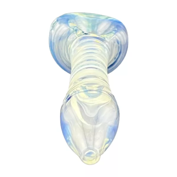 White glass spoon with blue and white spiral design, thin and curved shape, small bowl and narrow handle.