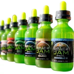 15ml Space Jam e-liquid in a green bottle, part of the Andromeda collection. Line of bottles with various labels and colors.