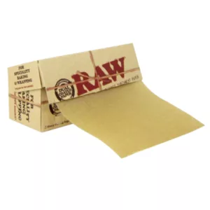 Empty brown paper box with RaW wrapper, containing unrefined parchment paper (8x8cm).