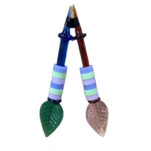 Colorful glass Leaf Ring Dabbers with striped and leaf patterns, clear bases and small holes for dabbing.