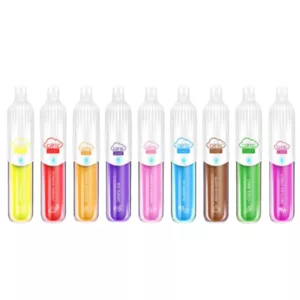 Six colorful vape pens in a line, each with a unique design and color. Green in the middle, followed by pink, yellow, blue, purple, and orange.