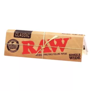 Authentic raw tobacco packaging in brown paper with red RAW label. Perfect for smoking enthusiasts.