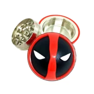 Cool, high-quality Deadpool grinder with a red and black metal design. Skull and crossbones logo in the center. Easy to use with a small handle on the side.