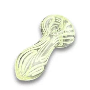 Clear glass pipe with mesmerizing spiral design, sitting on a white surface. Translucent and allowing light to pass through.