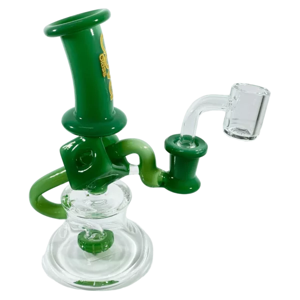 A clear glass bong with a green base and a long, curved neck, sitting on a small, round base with a small hole in the center.