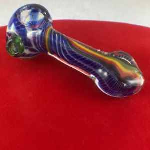 Handmade glass pipe with colorful swirl design and unique flame-shaped bowl.