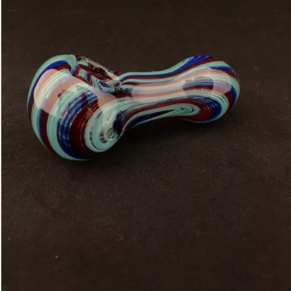 Sleek, modern small pipe with blue, teal, and red glass in a curved snail shape, featuring a swirled pattern and long thin stem.