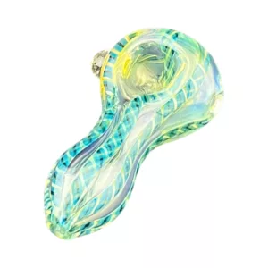 A small, intricately designed glass piece shaped like a turtle or alligator, with a flat bottom and raised bumps. It's colored blue and green and covered in wavy lines.