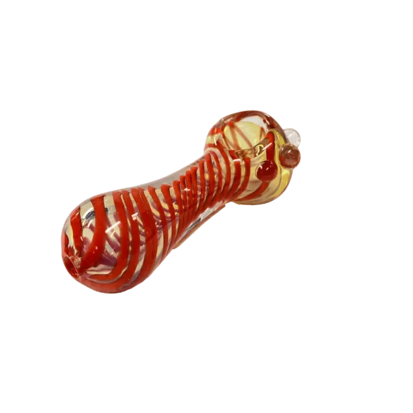 Red and white striped glass pipe with small hole at end, shaped like a tube, sitting on green background.