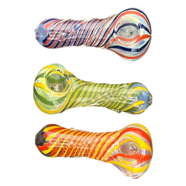 Three glass pipes with colorful swirls (red, blue, yellow) arranged in a row. Clear glass, smooth surface, lit from the side. White background.