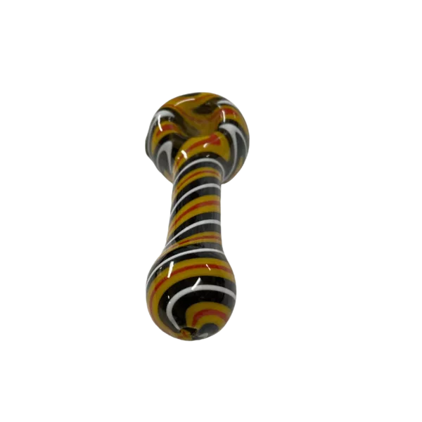 Glass pipe with yellow, black, and white stripes, curved shape, small bowl and hole, sits on green surface.