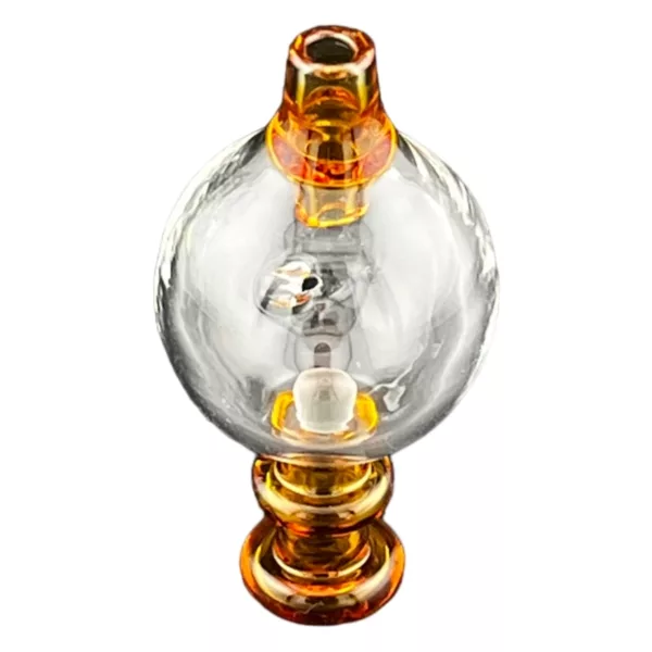 Glass orb with golden base and stand, suspended from white background. Orb has clear center and smooth surface, surrounded by clear glass base with small opening and indentations. Stand is made of metal with golden finish.