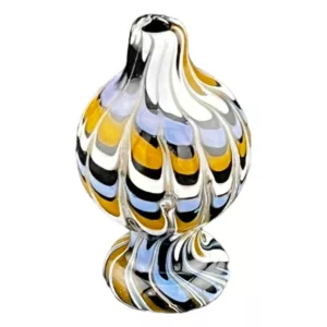A glass bird sculpture with multicolored, swirling design on its body, mounted on a white background. The sculpture has a dynamic appearance with spread-out wings and is vibrant and eye-catching.