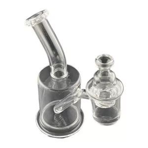 Clear glass water pipe with small hole at end and bowl, sitting on white background.