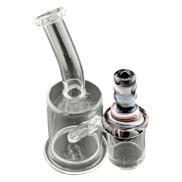 Glass water pipe with white, black and white swirl design, small hole and long stem with clear carb cap.