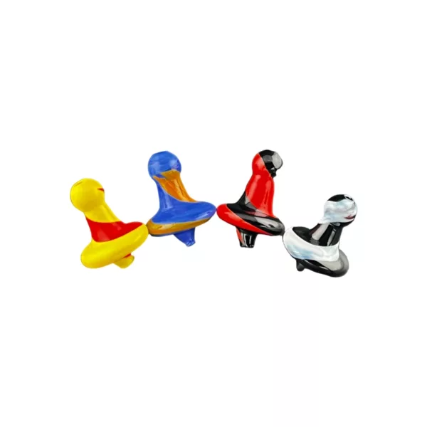 The image shows three plastic ducks in yellow, red, and blue on a white background, looking at each other. It's symmetrical and has a clear focus.