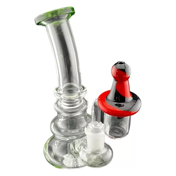 glass bubbler pipe with a red and black handle and a small chamber.