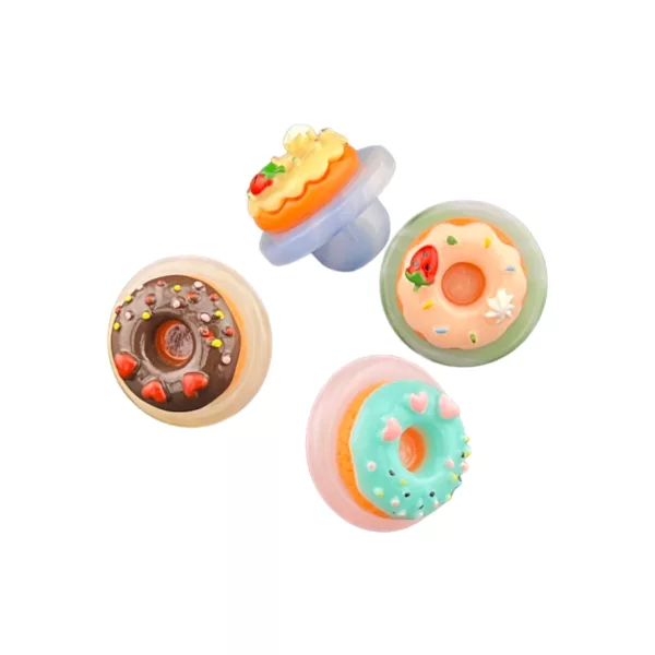Playful, whimsical donut carb cap in various colors and designs on white background.