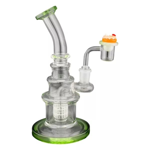 Glass bong with clear stem, green base, and small hole at top and bottom. Stem has knob and small green leaf on top. Sits on white base with small hole.