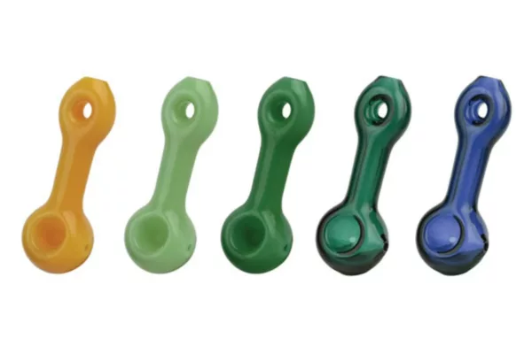 Six colorful glass pipes with metal donut handles, arranged in a line. Image shot from an elevated angle.
