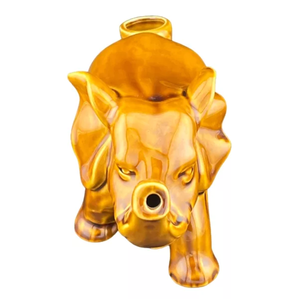 A golden pig statue on a white background, standing on its hind legs with its front legs on the ground.