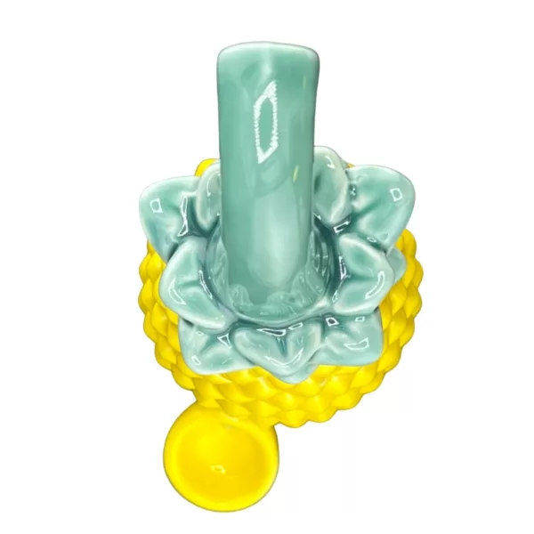 Unique pineapple-shaped pipe with yellow & white glaze, green stem, and yellow bowl with pineapple pattern. A fun & eye-catching smoking accessory.