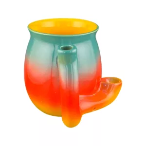Colorful gradient mug with smiley face handle and smoking pipe design.