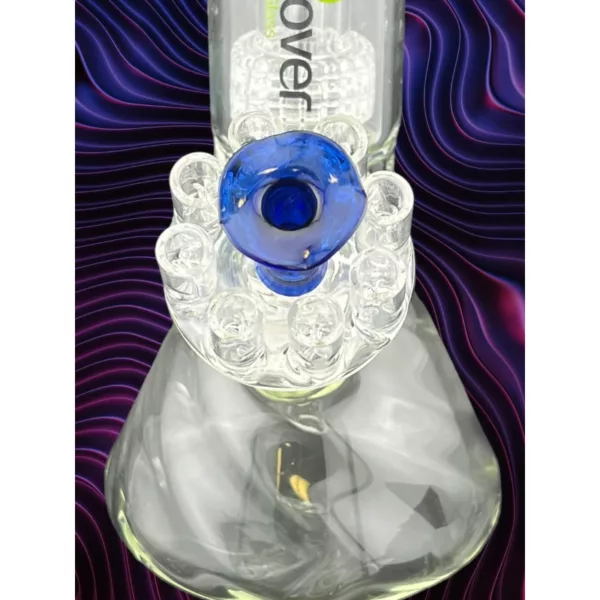 Blue glass vase with floating blue lightbulb in purple-blue swirls, emitting smoke. Jellyfish-inspired design.