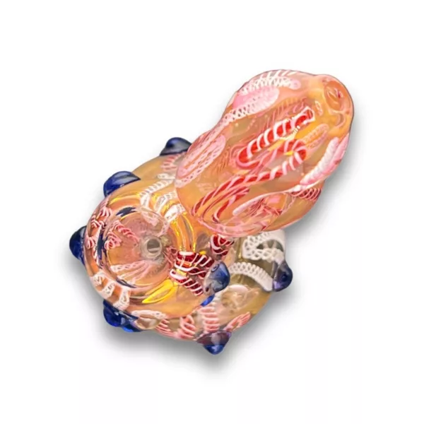 Handcrafted glass bubbler with red, blue, and white coloring and intricate swirling designs on front and back.