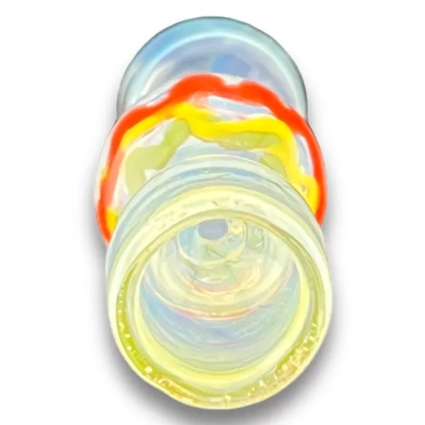 Glass pipe with yellow, red, and blue swirl pattern. Sits on white background. From Rasta Chillum - VSXY98.