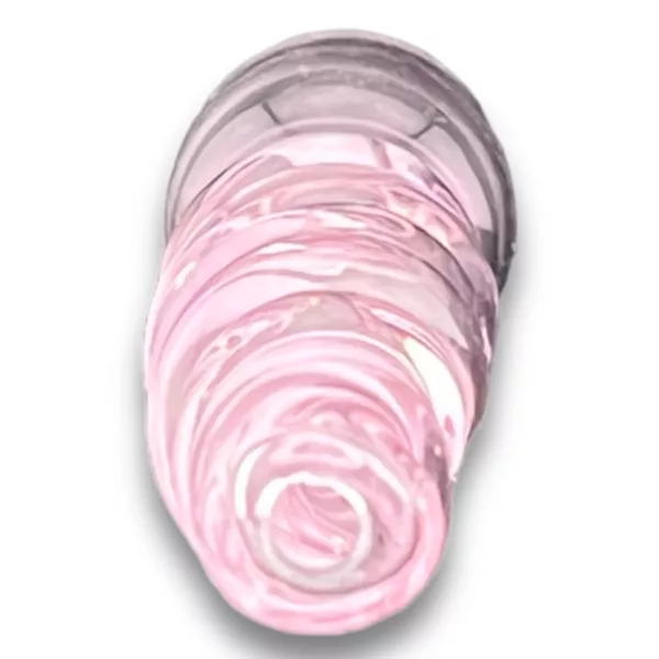 Close up shot of pink swirling liquid in clear container. Shot from low angle, white background. High resolution, studio setting. Horizontal & vertical orientations.