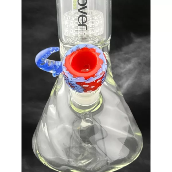 A glass bong with a red and blue swirl design, clear glass base and stem, and a small hole at the top, sitting on a black background.