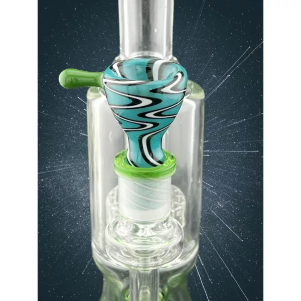 Stylish blue and white striped glass bong with clear stem and percolator, sitting on a black base with small hole.