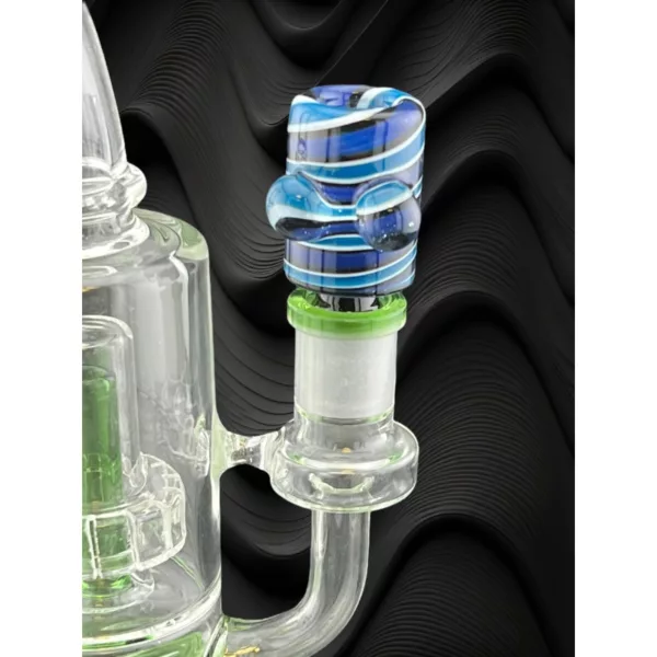 Glass bong with blue and green swirl design on outside and clear glass bowl with same design on inside. Black background.