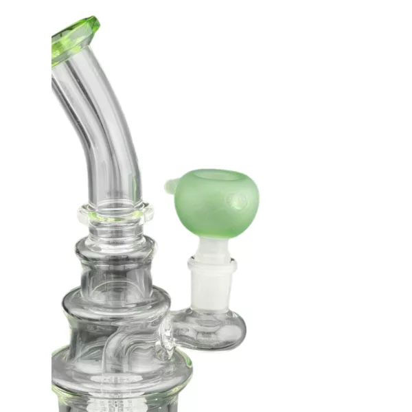 A clear glass bong with a green stem and a small hole at the top and bottom, sitting on a white background.
