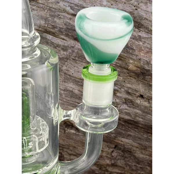 Frosted trapezoid bowl with green and white swirl pattern, made of clear glass and attached to a long stem with small knob on end.