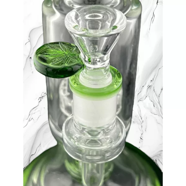 A green-stemmed, white-based glass bong with a leaf handle bowl, NN83914.