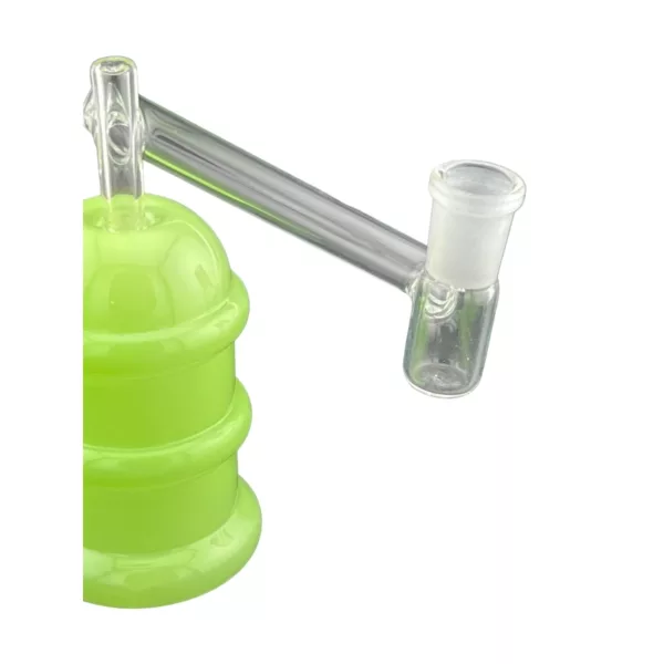 A green glass beaker with a clear plastic handle and two holes, sitting on a white background.