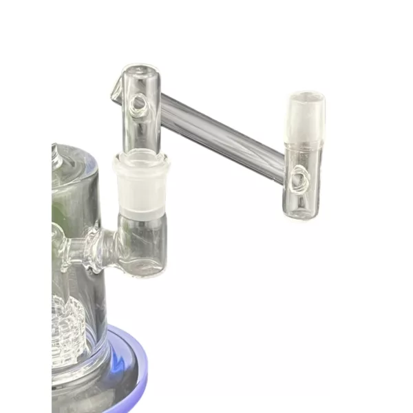 Glass bong with clear stem, blue base, and two bowls. Base has blue ring and small hole in center. Bong sits on white surface.