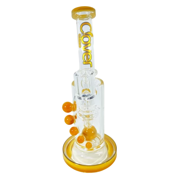 Glass bong with yellow and orange design. Small bowl and large stem with clear glass and small knob. Bowl has small hole in center. White background.